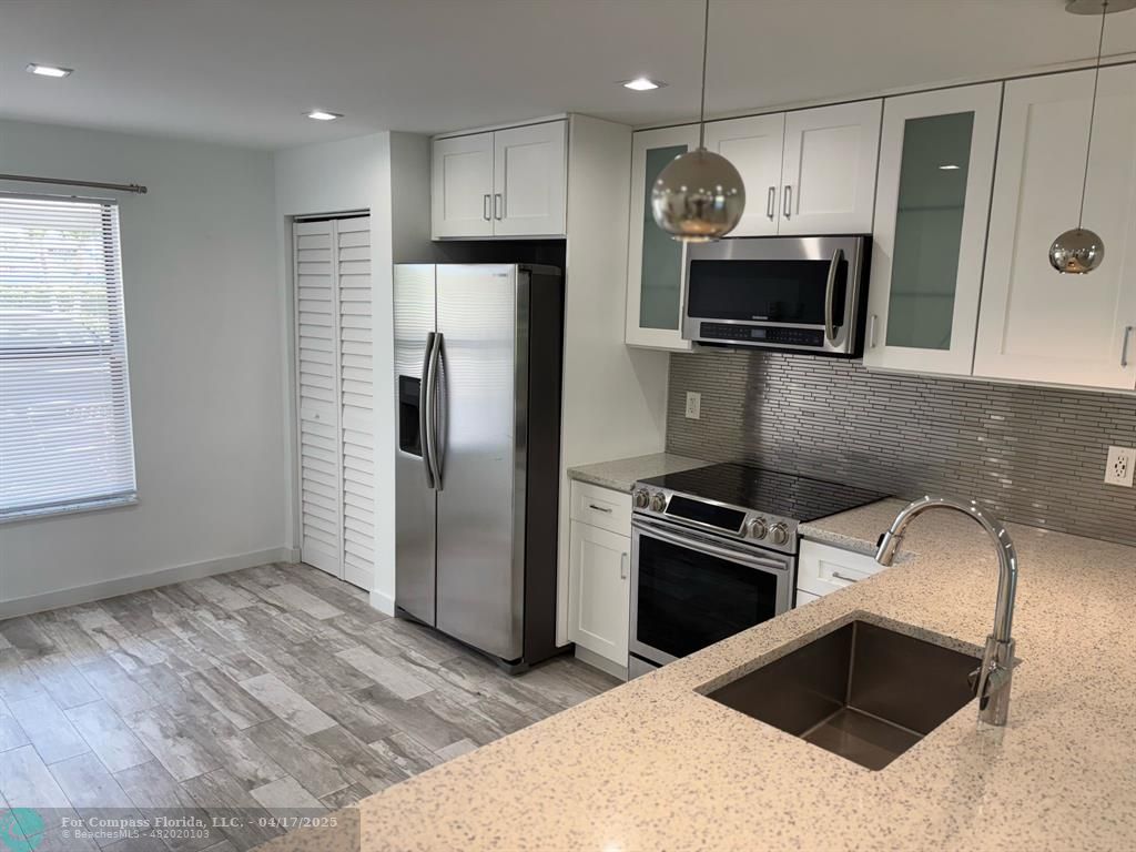1629 Riverview Road, Unit 120 Deerfield Beach, FL 33441 - Photo 3 of 28 Open Concept Kitchen