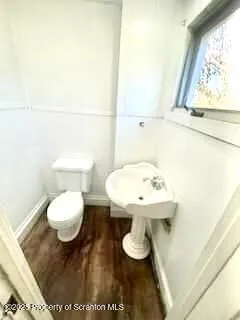 a bathroom with a toilet and a sink