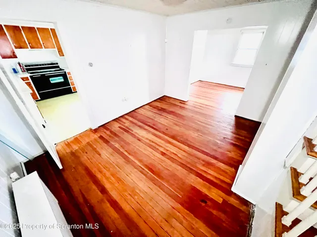 a bedroom with a bed and a night stand