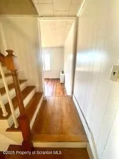a view of a living room with a wooden floor