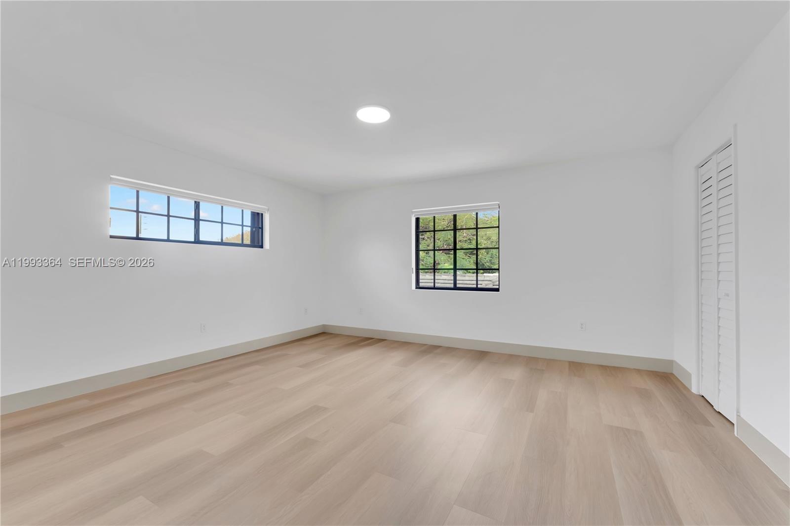 456 Southwest 20th Road, Unit 458 Miami, FL 33129 - Photo 30 of 37 an empty room with windows