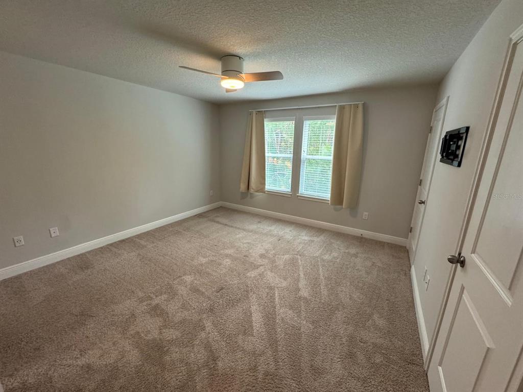 5912 Grand Sonata Avenue Lutz, FL 33558 - Photo 15 of 36 a view of an empty room with a window