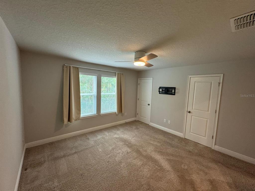 5912 Grand Sonata Avenue Lutz, FL 33558 - Photo 16 of 36 a view of an empty room with a window