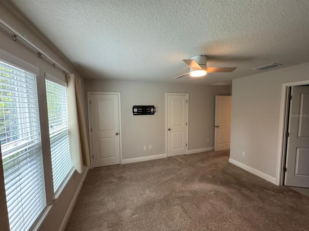 5912 Grand Sonata Avenue Lutz, FL 33558 - Photo 17 of 36 a view of an empty room with a window