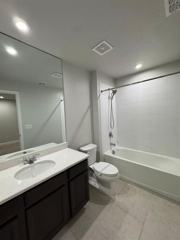 5912 Grand Sonata Avenue Lutz, FL 33558 - Photo 24 of 36 a bathroom with a double vanity sink toilet mirror and shower