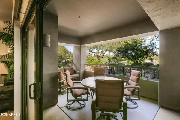 a dining room with furniture and a window