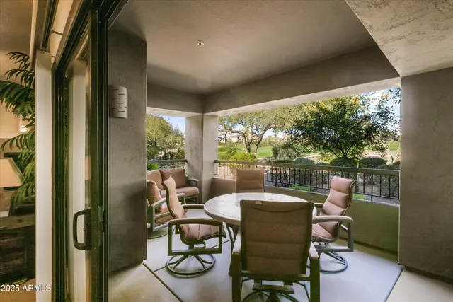 a dining room with furniture and a window