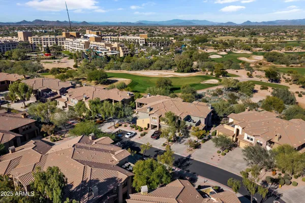 an aerial view of residential houses with outdoor space