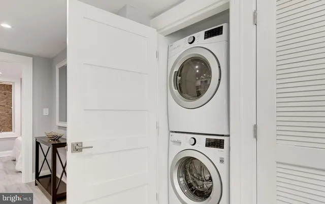 a view of livingroom with washer and dryer