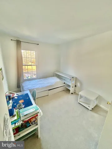 a room with pool table and windows