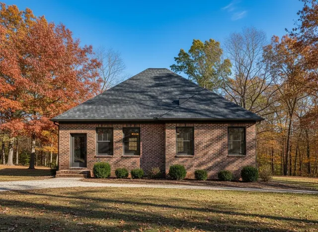 a view of a house with a yard
