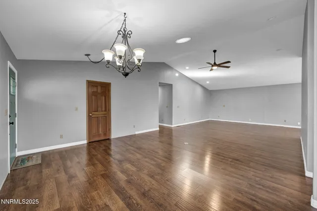 a view of kitchen with granite countertop a sink and a stove