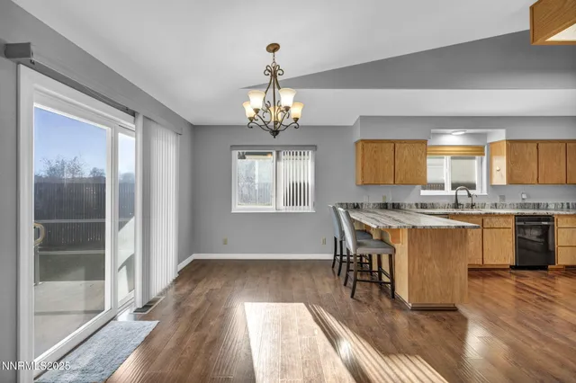 an empty room with a ceiling fan and a window