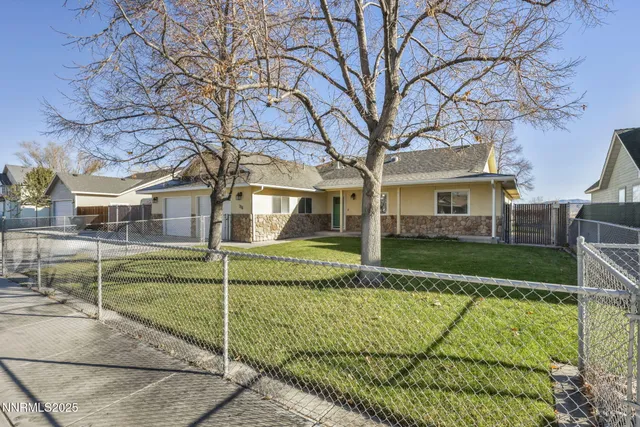 a view of a house next to a yard