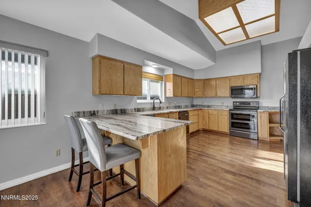 a bathroom with a granite countertop window