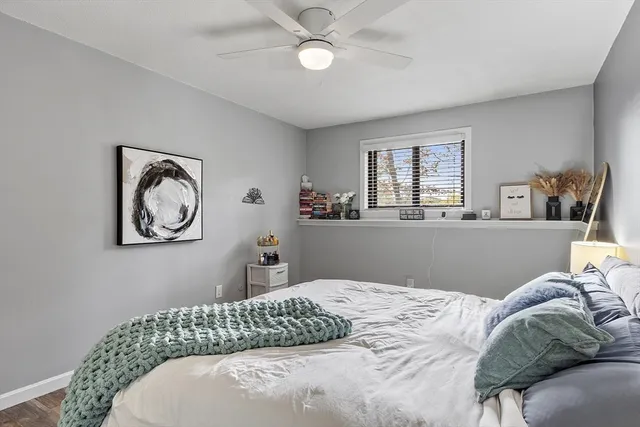 a bedroom with a bed and window