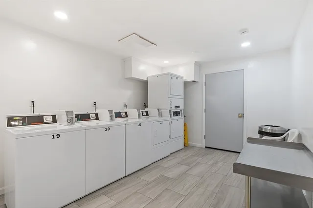 a kitchen with cabinets a sink and appliances