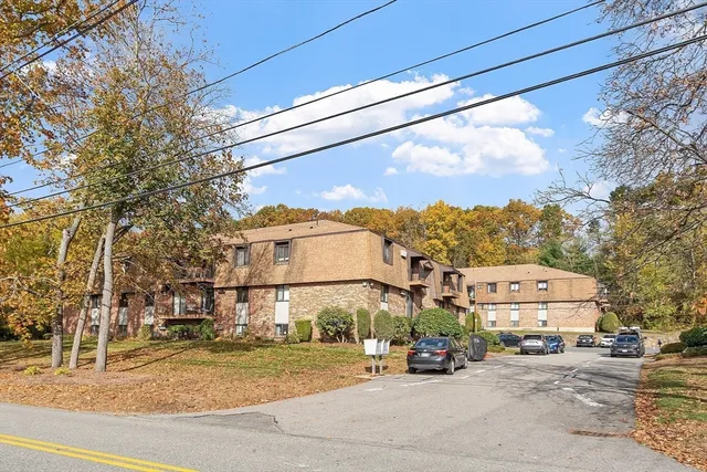 a view of a street with cars