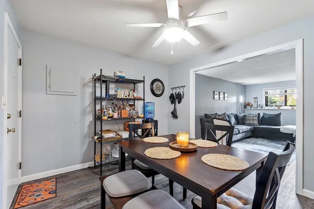 a view of a dining room with furniture and wooden floor