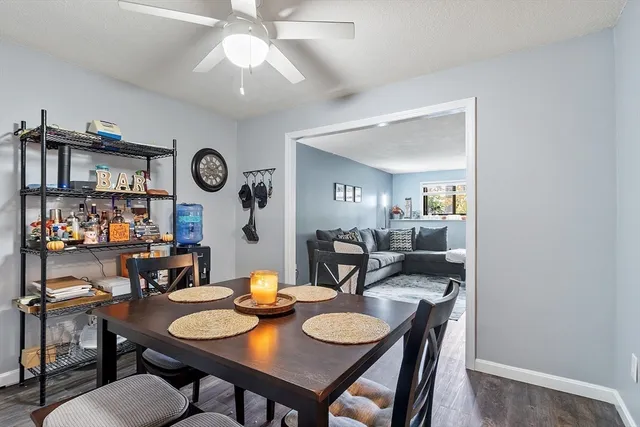 a view of a dining room with furniture and wooden floor