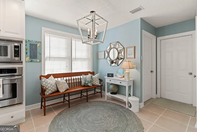 a bedroom with furniture and a window