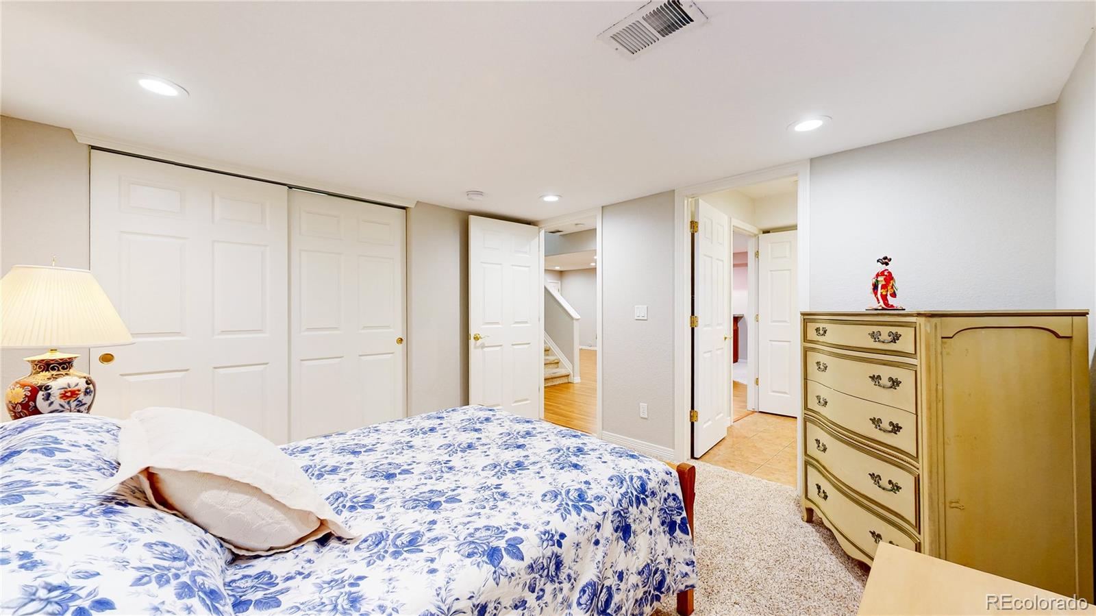 4545 South Monaco Street, Unit 138 Denver, CO 80237 - Photo 22 of 34 a bedroom with a bed and a cabinets