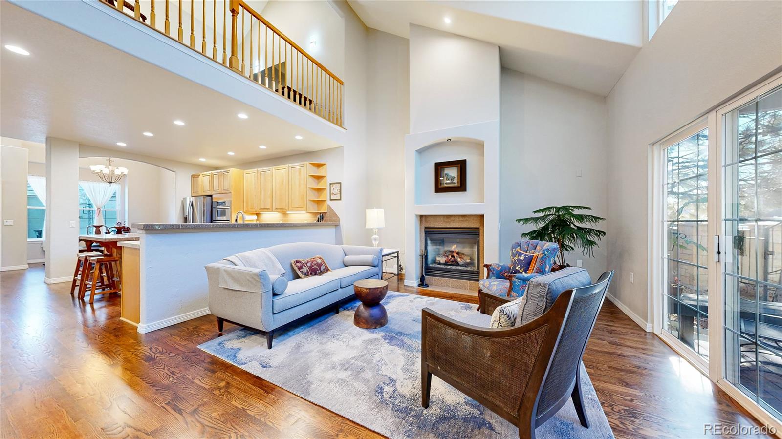 4545 South Monaco Street, Unit 138 Denver, CO 80237 - Photo 3 of 34 a living room with furniture and a fireplace