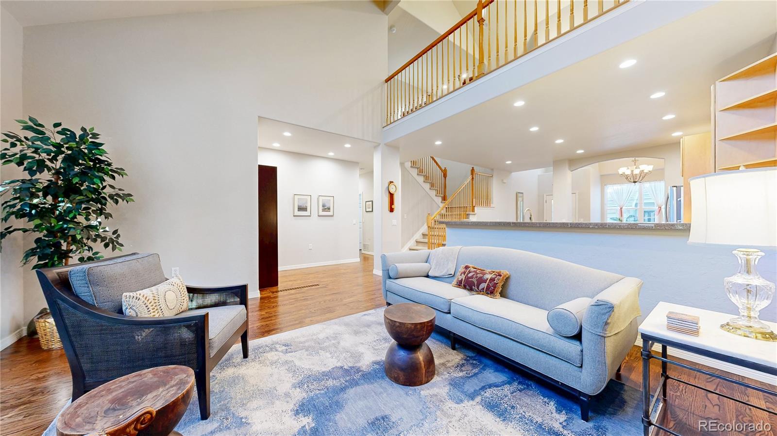 4545 South Monaco Street, Unit 138 Denver, CO 80237 - Photo 4 of 34 a living room with furniture and a potted plant