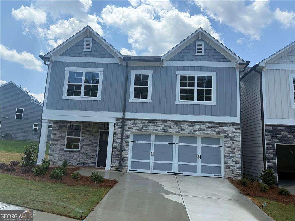352 Lakeside Drive Canton, GA 30115 - Photo 1 of 16 a front view of a house with a garden