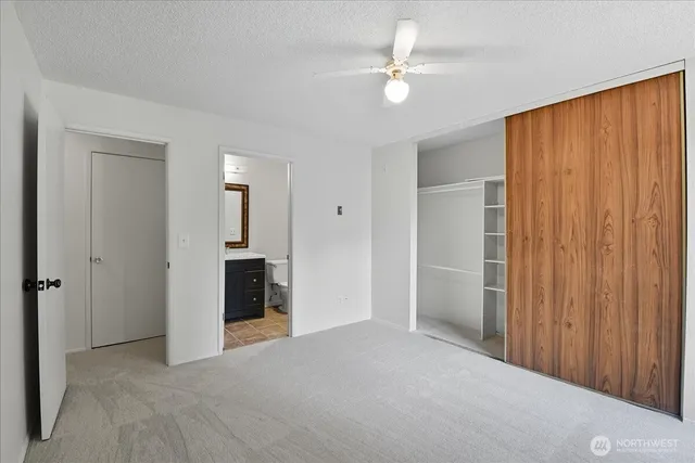 a bathroom with a sink vanity and toilet