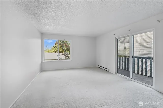 a kitchen with a sink and a granite counter top