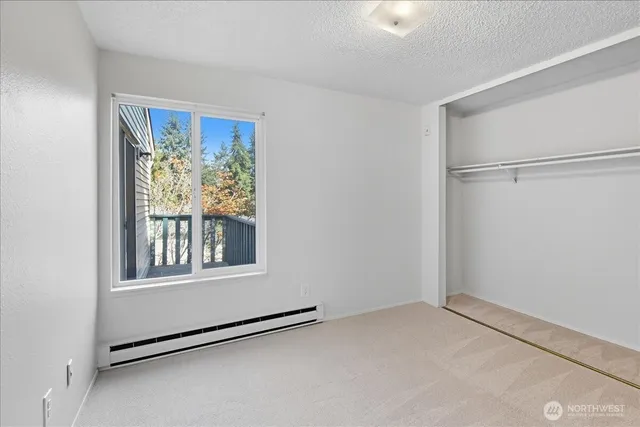a view of a livingroom with a ceiling fan and hardwood floor