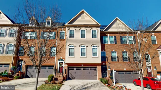a living room with furniture or wooden floor and a large window