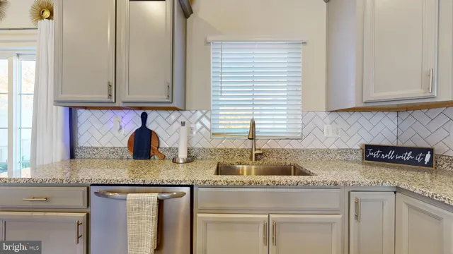 a bedroom with a bed couch and window