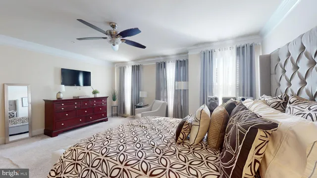 a view of walk in closet with clothes