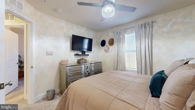 a view of washer and dryer with kitchen in the background