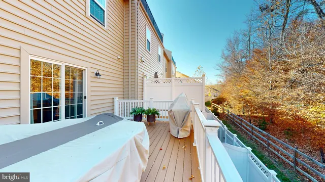 a view of field with grass and trees in the background