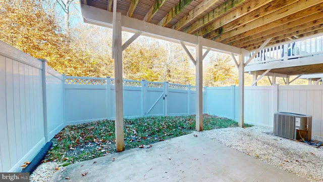a front view of a house with a garden and yard