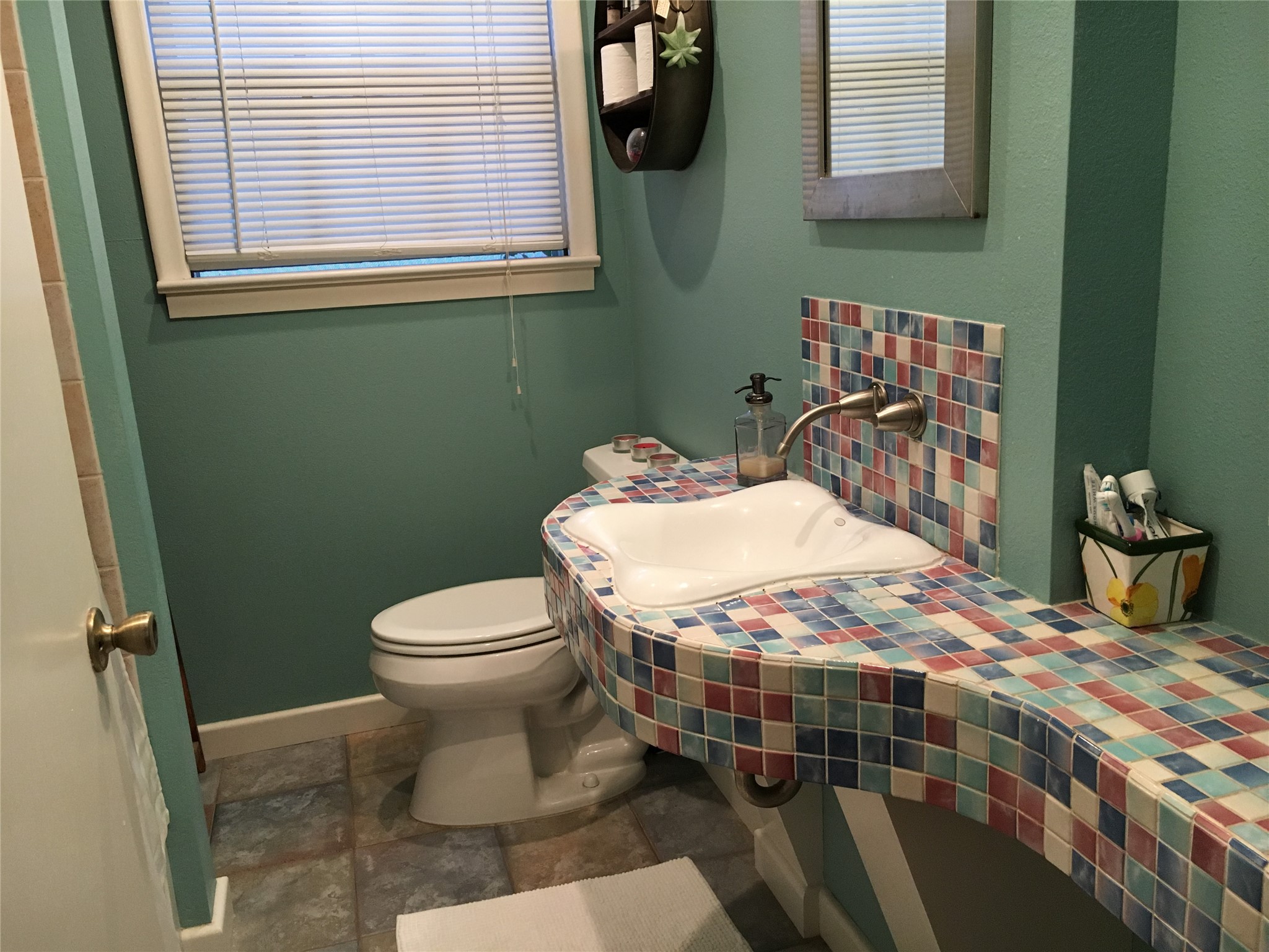 2639 West 45th Street Austin, TX 78731 - Photo 26 of 29 Full bathroom with dark stone finish flooring and vanity