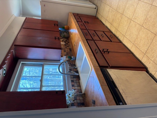 2639 West 45th Street Austin, TX 78731 - Photo 8 of 29 Kitchen featuring tasteful backsplash, ornamental molding, dishwasher, and freestanding refrigerator