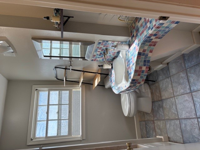 2639 West 45th Street Austin, TX 78731 - Photo 9 of 29 Bathroom featuring light stone finish floors and vanity