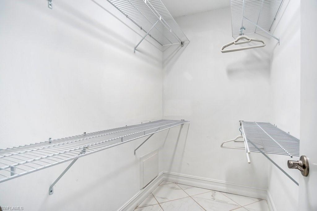 1207 Hernando Street Naples, FL 34103 - Photo 19 of 37 a view of a walk in closet
