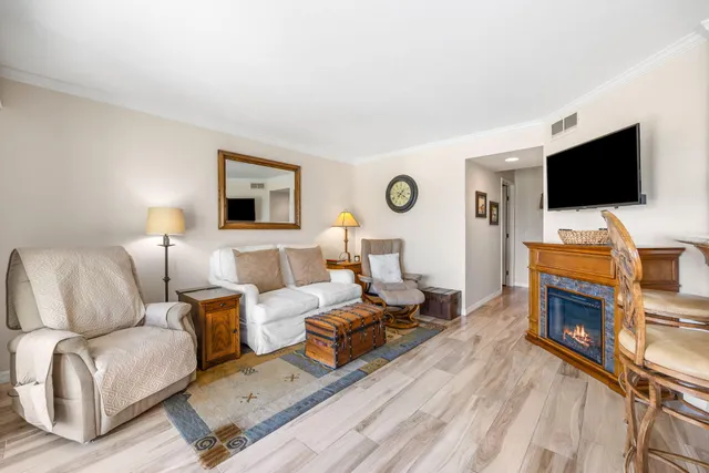 a large white kitchen with a large window