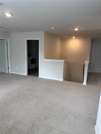 a bathroom with a toilet and a bathtub