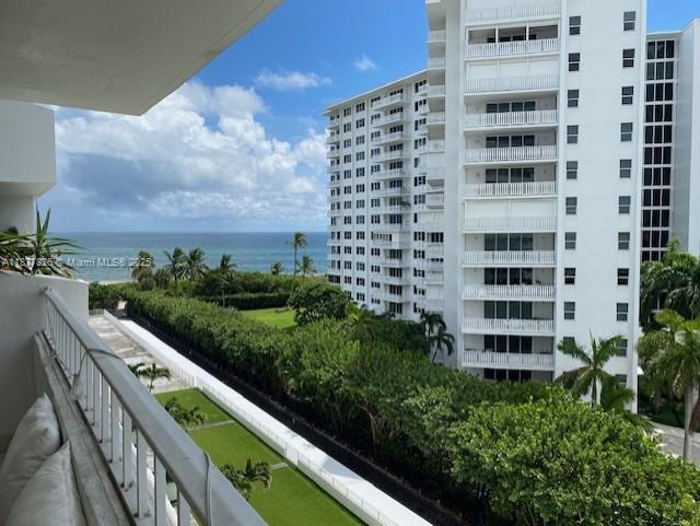 199 Ocean Ln Drive, Unit 707 Key Biscayne, FL 33149 - Photo 1 of 24 a view of a balcony with potted plants and brick wall