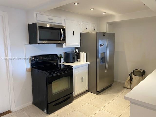 199 Ocean Ln Drive, Unit 707 Key Biscayne, FL 33149 - Photo 11 of 24 a kitchen with a refrigerator stove and microwave