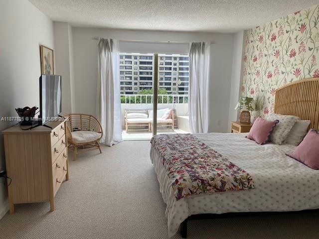 199 Ocean Ln Drive, Unit 707 Key Biscayne, FL 33149 - Photo 16 of 24 a bedroom with a bed couch and a large window