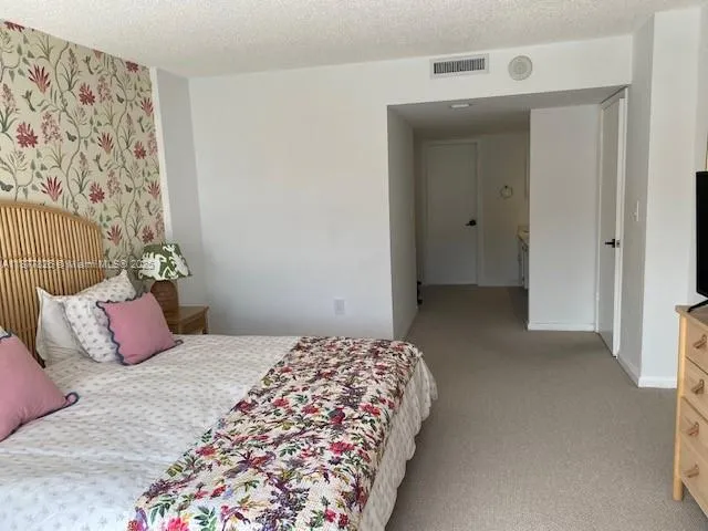 a bathroom with a shower and a sink