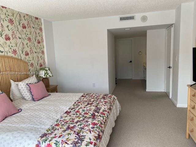 199 Ocean Ln Drive, Unit 707 Key Biscayne, FL 33149 - Photo 17 of 24 a bedroom with a bed and a window