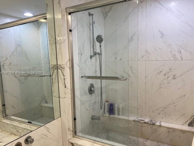 199 Ocean Ln Drive, Unit 707 Key Biscayne, FL 33149 - Photo 18 of 24 a bathroom with a shower and a sink